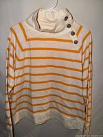 Front view showing stripes, funnel neck and button placket