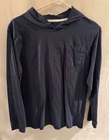 Front view of blue hooded long-sleeve t-shirt on hanger