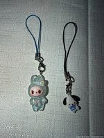 Both charms side by side showing size and design