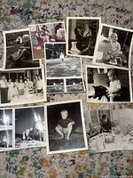 All eleven vintage photographs laid out on carpet