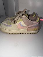 Lateral side view of both shoes showing colourway and overall wear