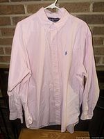 Front view of the Polo Ralph Lauren pink & white gingham shirt on hanger