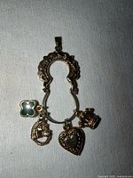 Front view of charm holder and four charms