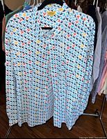 Front view of bird print shirt on hanger