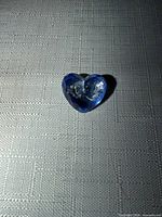 front view of blue crystal heart pin