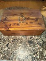 closed cedar chest top view showing carving