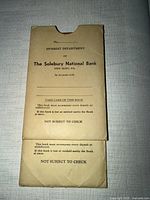 Two tan card sleeves labeled The Solebury National Bank Interest Department