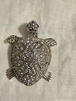 Front view of rhinestone turtle pendant