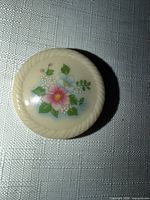 Front view of ceramic floral brooch