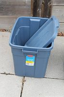Large Rubbermaid tote with lid leaning inside