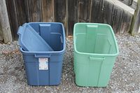 Blue and green totes side by side outdoors
