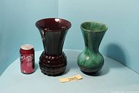 Red glass vase, green BMP Canada vase, and size reference can