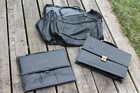 Overview of three black cases on deck