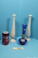 Group shot: two ivory Lenox vases, one cobalt blue vase, size reference with soda can