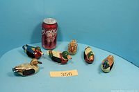 All six wooden duck napkin holders with soda can for scale