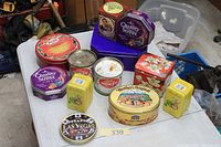 All 12 tins displayed on table