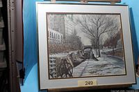 Full view of framed artwork on easel