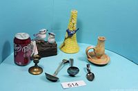 Group shot showing all items including figurines, vase, both candle holders, four spoons