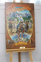 Entire poster on easel showing full graphics and title