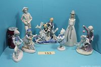 All seven porcelain figurines arranged for overview