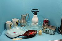 Full lot: mugs, pitcher, oil lamp, glass pan, basket, ashtray, change dish, votive holder