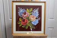 Frontal view of framed floral painting