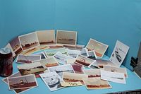 Overall view of spread of photographs with soda can for scale