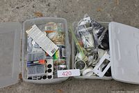Two clear tubs with assorted hardware contents and lot number card 420