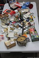 Entire table covered with assorted items