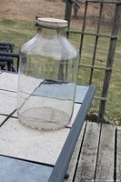 Full view of clear glass jar on table