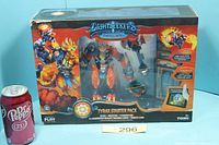 Front view of sealed Tyrax Starter Pack box beside soda can for scale