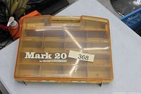 Closed tackle box, front view shows Mark 20 branding