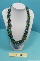 Necklace on display bust showing overall design and colours