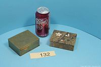 Brass box, stone inlay box and soda can for scale
