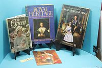 Front view showing four identified royal books and booklet