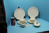 Full set showing two plates, two cups with saucers, creamer, covered sugar bowl