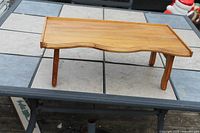 Top view of wooden folding bed tray table standing on legs
