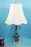 Full view of table lamp with shade, cord and soda can for scale