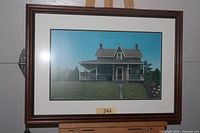 Front view of framed Ken Wilkens "Tobermory" print on easel