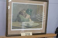 Framed signed James Lumbers print showing child writing at desk