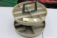 Top view of round two-tier parts caddy showing compartments and handle