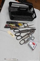 Lot overview showing tin snips, screwdrivers, tape measure and tray