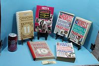 Full group of six price-guide books with soda can for scale