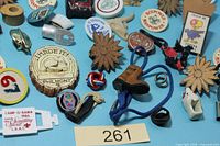 Group of assorted BSA slides on blue background, center Philmont slice, carved flowers, rope and leather examples