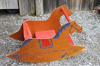 Overall view of wooden horse rocker left side