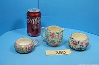 front view of three-piece chintz set with size reference