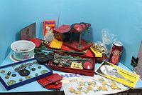 Overall view of assorted Meccano parts, manuals, trays and loose hardware