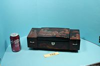 Full view of jewellery music box closed next to soda can for scale