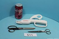 All three scissors with can for scale and lot number