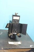 Front angled view showing binocular eyepieces and folding panels